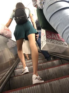 Girl in Shorts with Long Skinny Legs on the Subway Escalator Candid