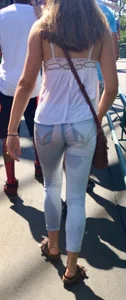 Girl in wet jeans making them semi see through
