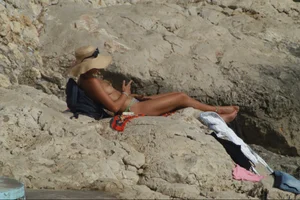 Girls on a nude beach in Sitges, Spain