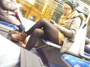 A Redhead Girl in a Skirt With Incredibly Hot Legs in Black Pantyhose Sitting Cross-Legged in a Public Bus Creepshot