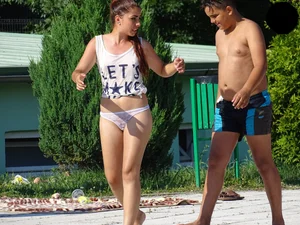 Hot chick with a nice ass at the pool in a white see through thong