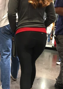 Pretty girl shopping with boyfriend in leggings with a nice ass