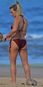 Hilary Duff in maroon bikini on the beach with a big booty