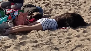 Beautiful Teen with Miniskirt resting on the beach