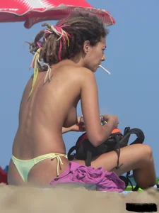 Sexy girls going topless at the beach showing off their sexy bodies