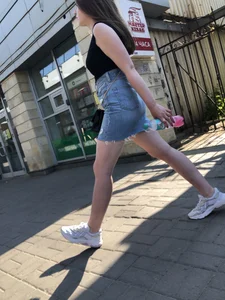 Hot chick wearing a fringed skirt walking up the stairs