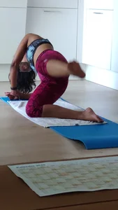 Sexy girlfriend doing yoga at home in leggings
