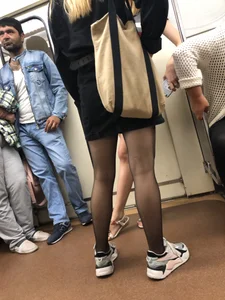 Nice candid legs in black pantyhose in a subway train