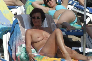Girls on a nude beach in Sitges, Spain