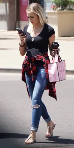Hot blonde in jeans after shopping at Victoria Secret