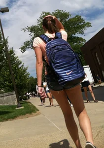 Hot college girl in little jean shorts showing some cheeks and legs