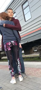 Skinny Teen With Nice Thin Legs in Spandex Tights Hugging Her Friends at a Railway Station Photos