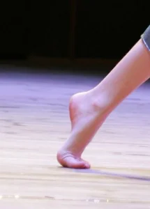 Closeup Photo of a Teen Girl's Bare Foot on Tiptoe