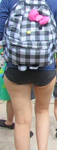 Girl with slight cheeks in little spandex shorts