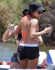 Sexy party girls in bikinis on a lake