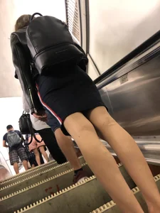 Hot Legs in a Skirt and Sandals on the Subway Escalator Closeups
