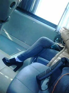Nice crossed legs in tight jeans and high heels in public transport creepshot