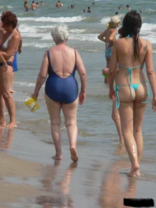 Bunch of sexy babes at the beach in thong bikinis