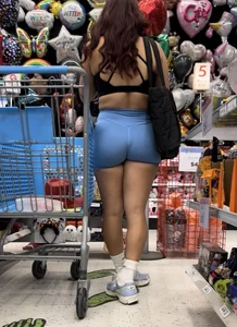 Sexy Latina in tight blue spandex shorts