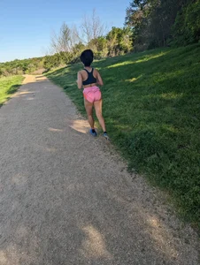 Fit asian chick running in tight pink shorts