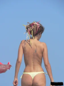 Sexy girls going topless at the beach showing off their sexy bodies