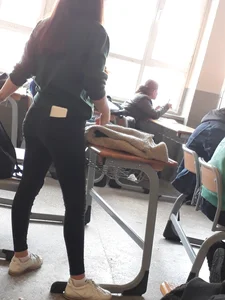 Teen Female Student In Tight Jeans With a Phone In Her Back Pocket, Photos in Class