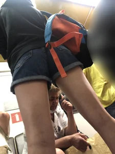 Girl in Shorts Standing in a Subway Train With Spread Legs - Creepshots Gallery