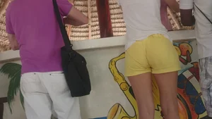 Milf in yellow shorts with vpl and a wedgie