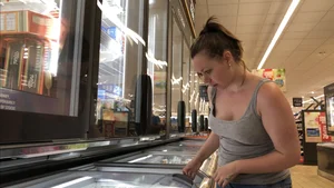 Thick girl showing cleavage while downbloused at the market