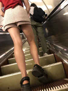Amazing Long And Slim Legs of a Candid Girl Standing on the Subway Escalator