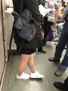 Cute Girl in a Mask With Sexy Legs Reading in a Subway Train Creepshots Gallery