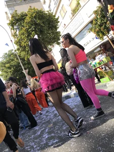 Hot carnival girl in in a top, mini shorts with pink frill and awesome legs in fishnet pantyhose