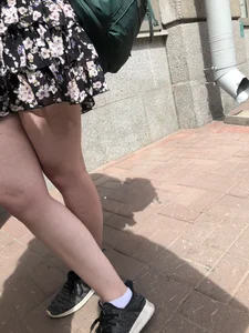 Canidd girl wearing a dress with nice legs
