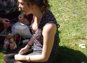 2 sexy girls showing nice cleavage while sitting together
