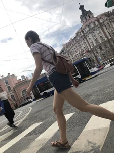 Young Girl in Shorts And Sandals Crossing the Street Gallery