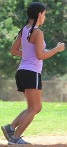 Hot brunette running in short shorts with vpl
