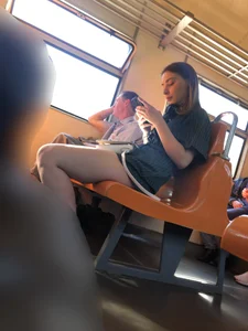 Amazing Hot Girl Sitting in the Train in Shorts Showing Off Her Gorgeous Legs Candid Gallery