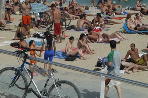 Topless girls on a beach in Barcelona