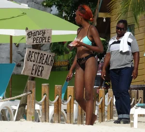 Candid black family, milf and teens on the beach in bikinis
