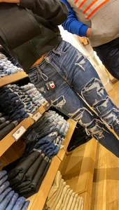 Teen in tight jeans looks to buy another pair