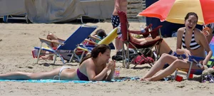 Two beach friends looking sexy in bikinis