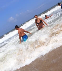 Thick beach girl with massive boobs