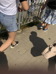 Cute Girl in Denim Shorts Walking Down a Railway Station Gallery