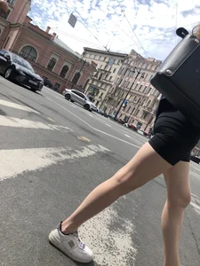 Great legs and booty in spandex shorts of a street candid girl crossing the street