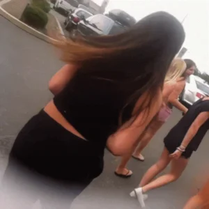 Teens fooling around on the street, pulling down pants