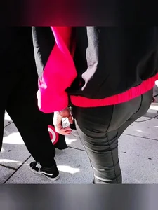 Ass in leather pants closeups on the street