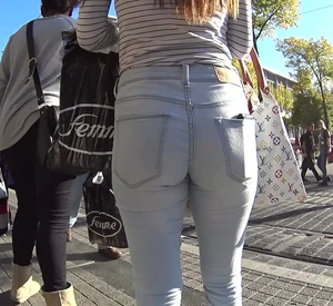 A sexy brunette teen out in tight white jeans with a couple sexy friends
