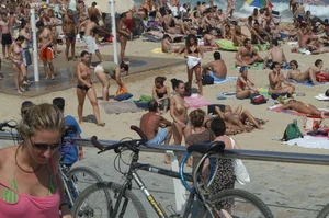 Topless girls on a beach in Barcelona