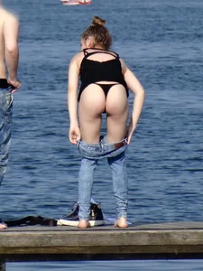 Girl on the water in black thong bikini with a nice ass