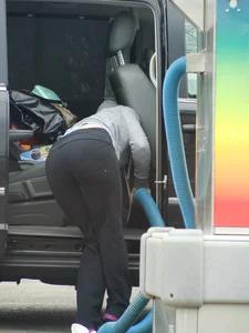 Girls cleaning their cars in jeans and pants